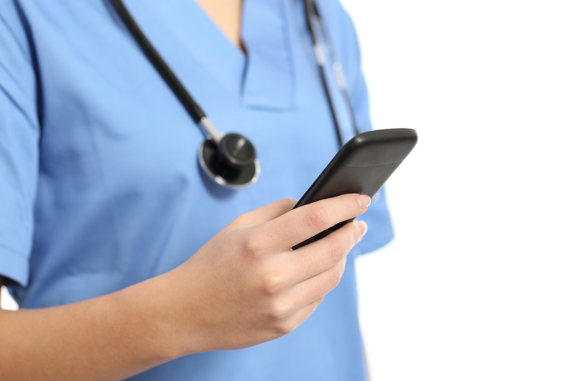 Photo of nurse on her cell phone