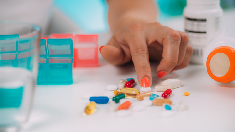 photo of patient sorting lots of medication