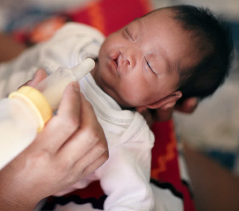 photo of infant with cleft lip getting specialty bottle