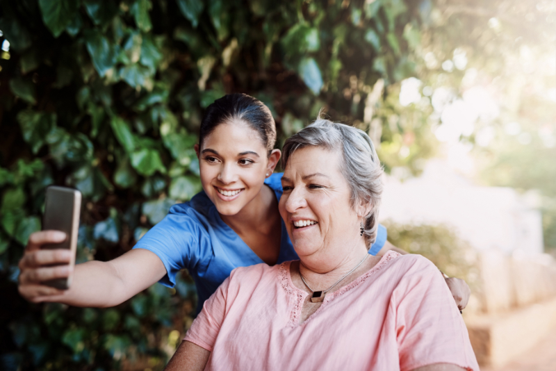 photo of a nurse taking a selfie with patient